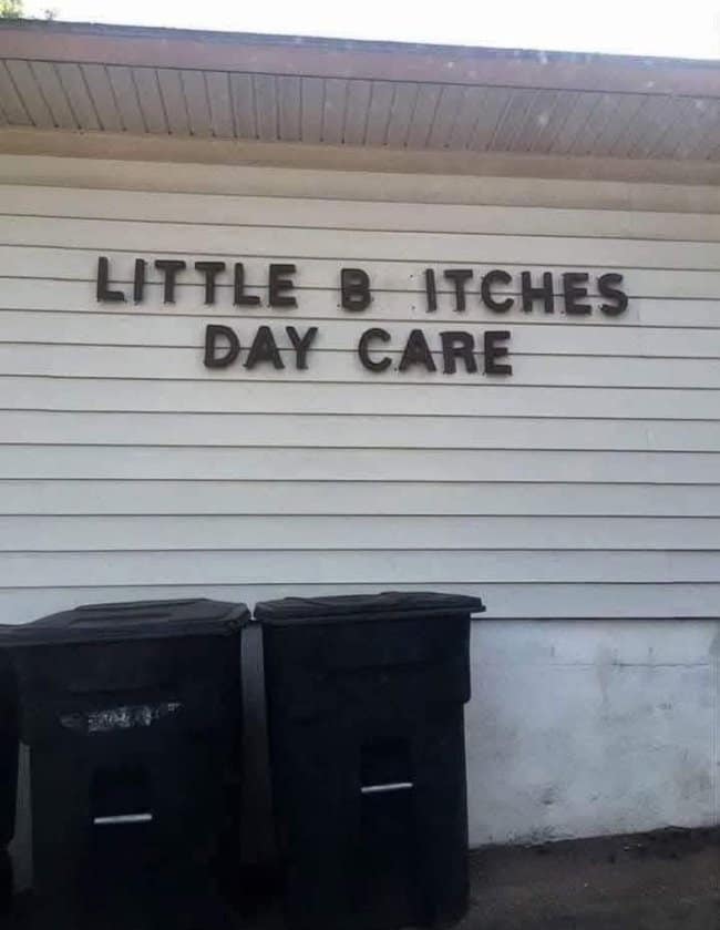 House siding with letters spelling a daycare name with an unfortunate missing letter.