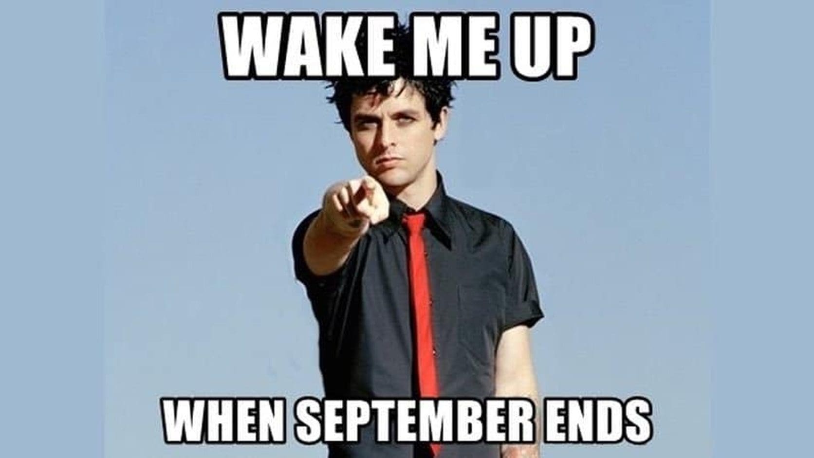Billie Joe Armstrong in a black shirt and red tie points at the camera under the classic caption from Wake Me Up When September Ends memes.